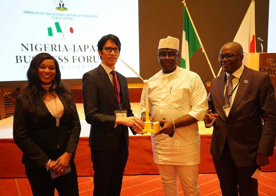 Akio Hashimura presenting Hon. Minister Of State Budget And National Planning of Nigeria a model of the Raijin Float